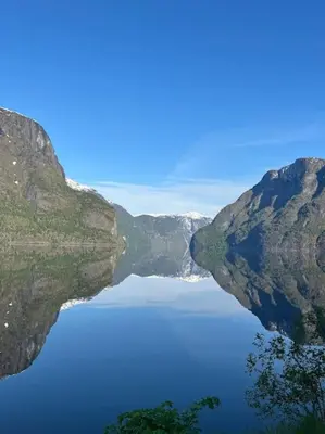 a large body of water between two mountains at Nyrestaurert hus fra 1700-tallet in Bjørgo