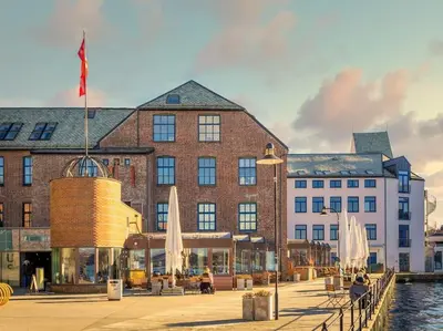 a large building next to a body of water at Cozy studio in Bergen center in Bergen