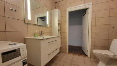 a small bathroom with a sink and a toilet at Stylish & Modern Apartment, in Centre, Free Parking spot ! in Trondheim