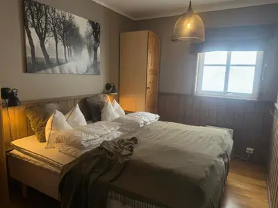 a bedroom with a bed and a window at Cozy 3 Bedroom, Terrace, Pets Welcome in Beitostøl