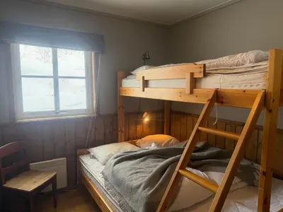 a bedroom with two bunk beds and a window at Cozy 3 Bedroom, Terrace, Pets Welcome in Beitostøl