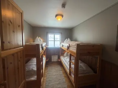 a room with three bunk beds and a window at Cozy 3 Bedroom, Terrace, Pets Welcome in Beitostøl