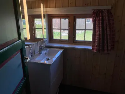 a bathroom with a sink and a window at Old Cabin Vibe, Perfect For Families Or Couples in Beitostøl