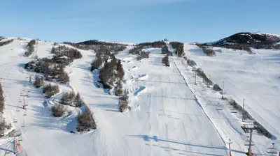 a ski slope with snow and trees on it at Old Cabin Vibe, Perfect For Families Or Couples in Beitostøl