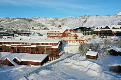 a resort in the snow with snow covered buildings at Your Perfect Base In Beitostølen Sleeps 8! in Beitostøl
