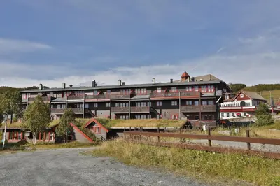 a large building with a grass roof at Your Perfect Base In Beitostølen Sleeps 8! in Beitostøl