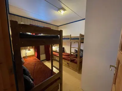 a room with two bunk beds and a hallway at Your Perfect Base In Beitostølen Sleeps 8! in Beitostøl
