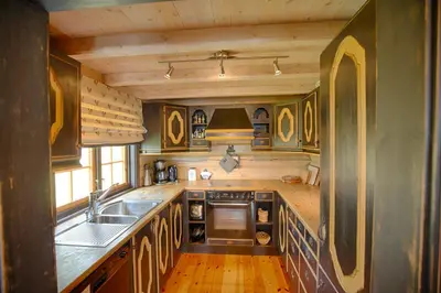 a kitchen with a sink and a counter top at Mountain Getaway With Sauna And Views in Beitostøl
