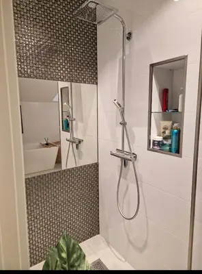a bathroom with a shower with a glass door at Ski-VM i Trondheim 2025, house with 5 big bedrooms in Trondheim