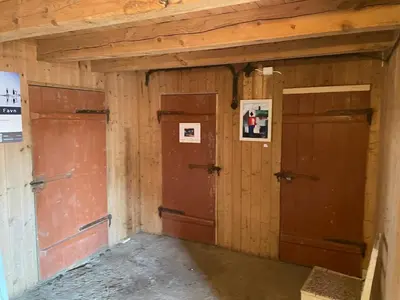 an empty room with two doors in a building at Ner-Grefstad gard in Kallstad