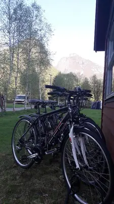 two bikes are parked next to a building at Bøyum Camping in Fjarland