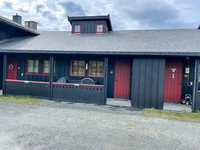 a house with red doors and a black roof at Perfect Retreat For Small Families in Beitostøl
