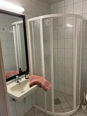 a bathroom with a shower and a sink at Perfect Retreat For Small Families in Beitostøl