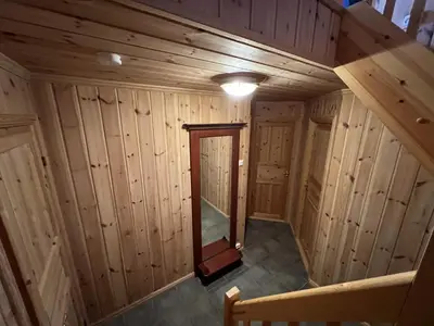 an overhead view of a room in a wooden cabin at 3-Story Apartment Near Slopes With Sauna And Views in Beitostøl
