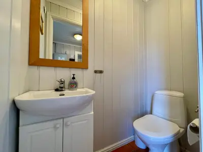 a bathroom with a sink and a toilet at 3-Story Apartment Perfect For Up To 10 Guests in Beitostøl