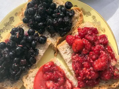 a plate with two slices of bread with fruit on it at 8 person holiday home in frosta in Vollen