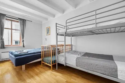a bedroom with two bunk beds in it at Experience Norway's History I With Free Parking in Bergen