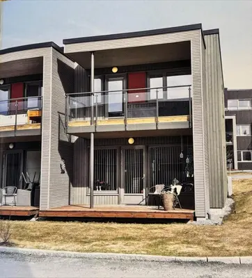 a large house with a porch and a balcony at Rekkehus til leie under ski-VM in Heimdal