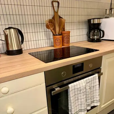 a kitchen with a stove and a counter top at Panoramic Fjord View near Bergen in Bergen