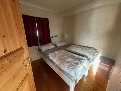 a small room with a bed and a window at Charming Cabin Ski-In Access And Pet Friendly in Beitostøl