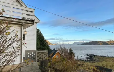 a house with a view of a body of water at Cozy Home In Nerlandsøya Grunnkrets in Kvalsvik