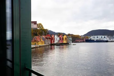 a view of a river with houses and a city at Beautiful Harbour Apartment With French Balcony in Bergen