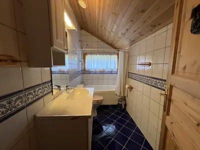 a small bathroom with a sink and a toilet at Grand Log Cabin With Fireplace And 12-14 Beds in Beitostøl