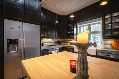 a kitchen with a table with a candle on it at Hemsedal Mountain Retreat in Hemsedal