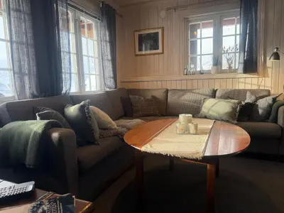a living room with a couch and a coffee table at Apartment By Cross-Country And Alpine Slopes in Beitostøl