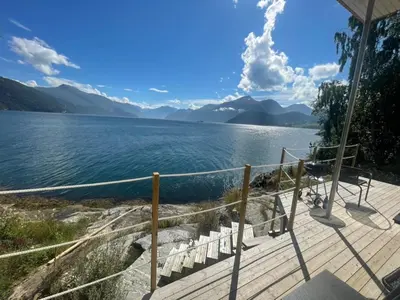 a deck with a view of a body of water at Amazing View in Stranda