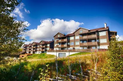 an apartment building on top of a hill at Bright, Open Apartment In Beitostølen in Beitostøl