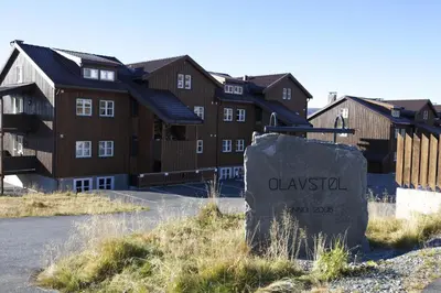 a row of houses with a sign in front at Bright, Open Apartment In Beitostølen in Beitostøl