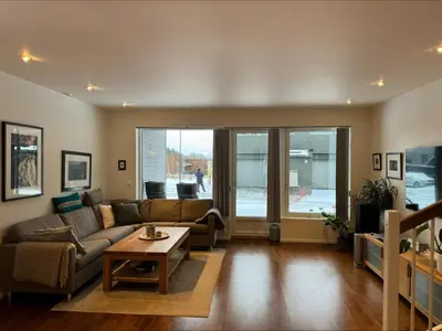 a living room with a couch and a table at Skyttarbakken 57 in Heimdal