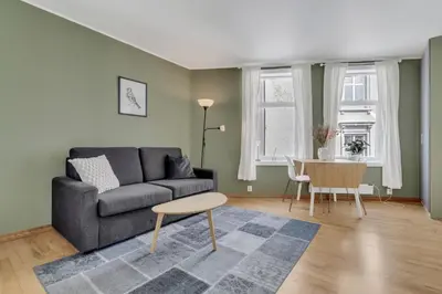 a living room with a couch and a table at City Retreat in Bergen