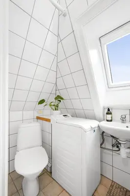 a bathroom with a toilet and a sink at City center apartment with teracce in Bergen
