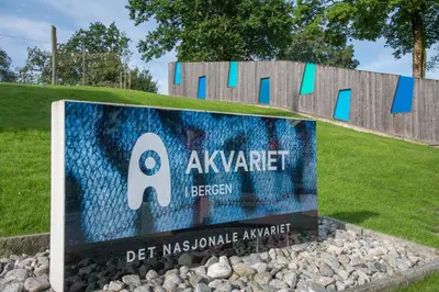 a sign at the entrance to a park at City center apartment with teracce in Bergen