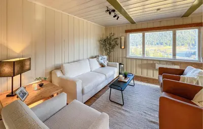 a living room with a couch and two chairs at Beautiful Home In Vestre Gausdal in Vestre Gausdal