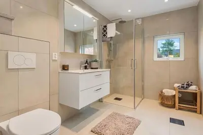 a bathroom with a shower and a toilet and a sink at Flott bolig til VM! Gåavstand in Trondheim
