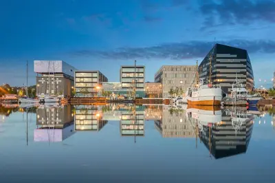 a marina with boats in the water and buildings at Charming Loft, High Ceiling !Modern & Central, Free private Parking 7 min walking ! in Trondheim