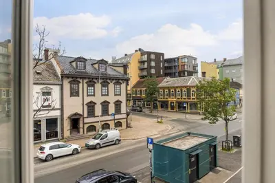 a view of a city street with cars and buildings at Charming Loft, High Ceiling !Modern & Central, Free private Parking 7 min walking ! in Trondheim