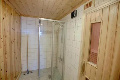 a bathroom with a shower with a glass door at Large Cabin with Stunning Views! in Beitostøl