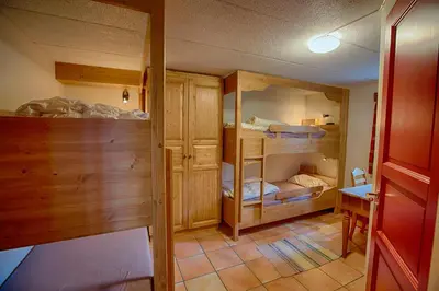 a room with several bunk beds in a room at Large Cabin with Stunning Views! in Beitostøl