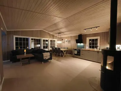 a large living room with a couch and a table at Hytte-23 Cozy cabin close to Kvitfjell in Fåvang