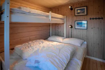 a bedroom with a bunk bed in a cabin at Vikinggrenda 21B in Trysil