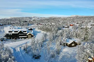 an aerial view of a village covered in snow at Modern Comforts, and Ski Access in Beitostøl