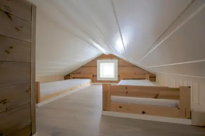 a room with two beds in a attic at Modern Comforts, and Ski Access in Beitostøl