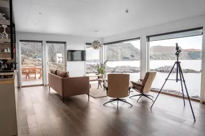 a living room with a camera and a camera tripod at Runde Panorama - Batavia Dream in Terøy