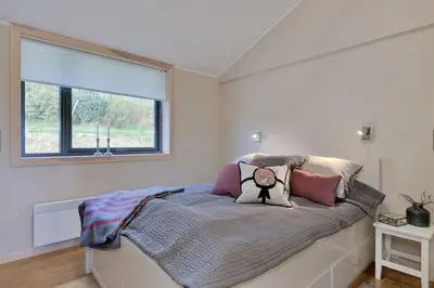 a bedroom with a bed with a pillow on it at Modern Apartment with 3 Bedrooms and Stunning View in Beitostøl