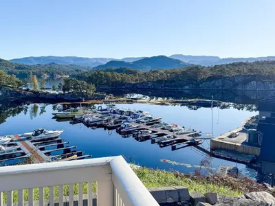 a bunch of boats are docked in a marina at 6 person holiday home in HOSTELAND in Hosteland