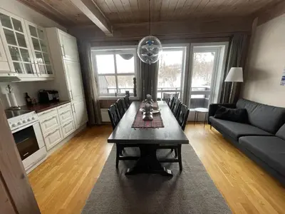 a living room with a table and a couch at Perfect For Skiing And City Access in Beitostøl